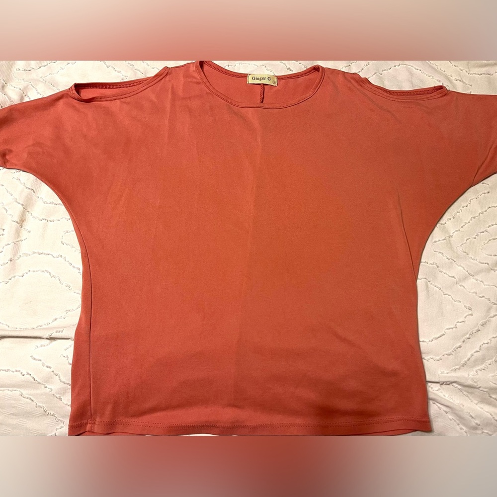 Ginger G. Size S. Pink 3/4 sleeve top with small cut outs on shoulders